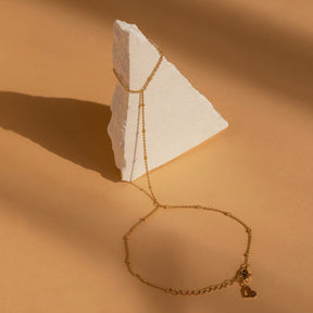 Pulseira de corrente de mão com contas