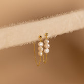 Brincos de pérola tripla
